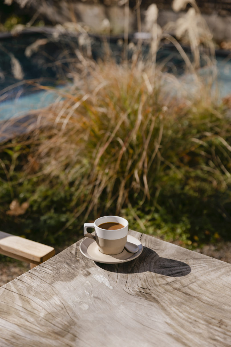 white and terracotta coffee mug outdoors