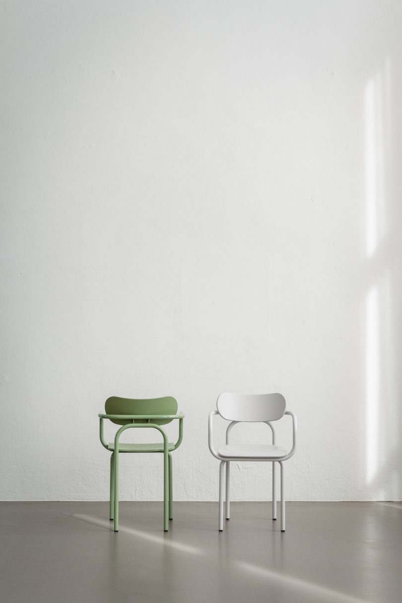 green and white armchairs