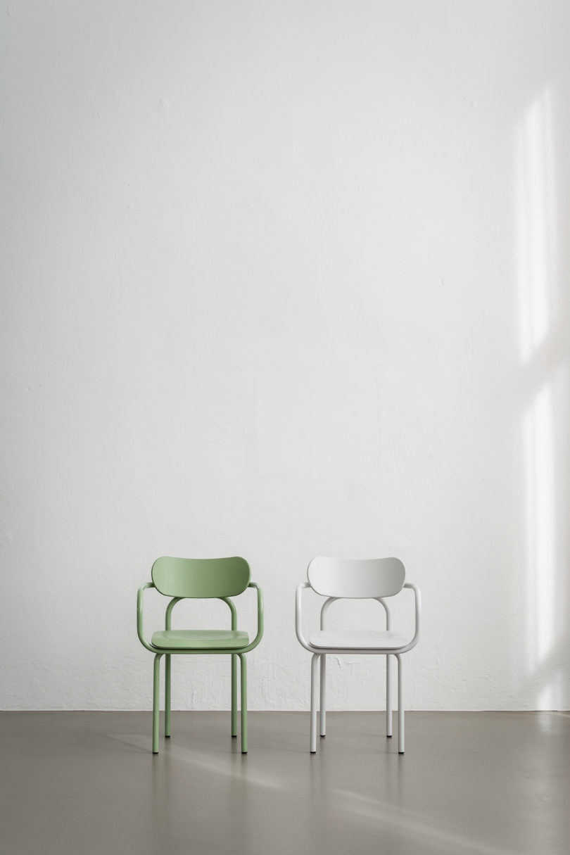 green and white armchairs