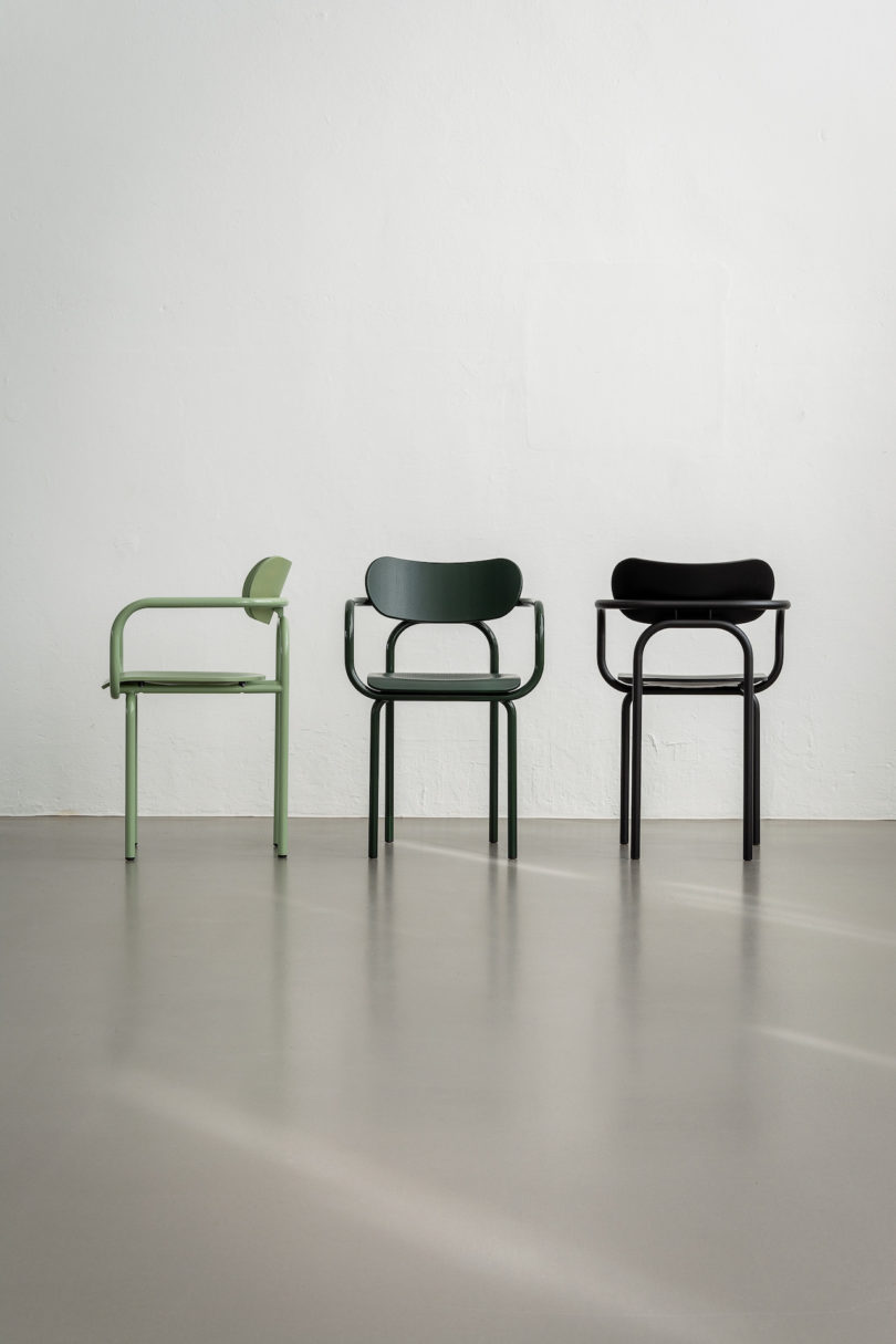 green, navy and black armchairs