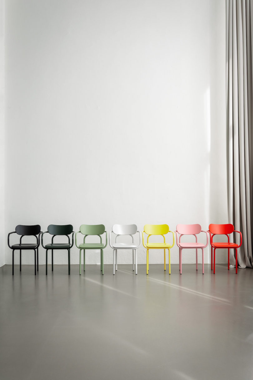 rainbow of armchairs in a line