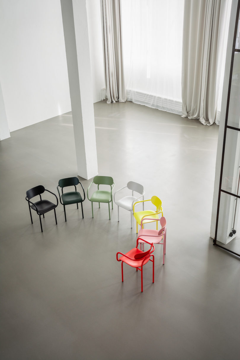 rainbow of armchairs forming a half circle