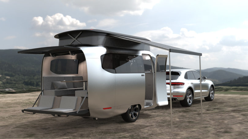 The Airstream Studio F. A. Porsche Concept Travel Trailer opened up with awning and doors wide open.