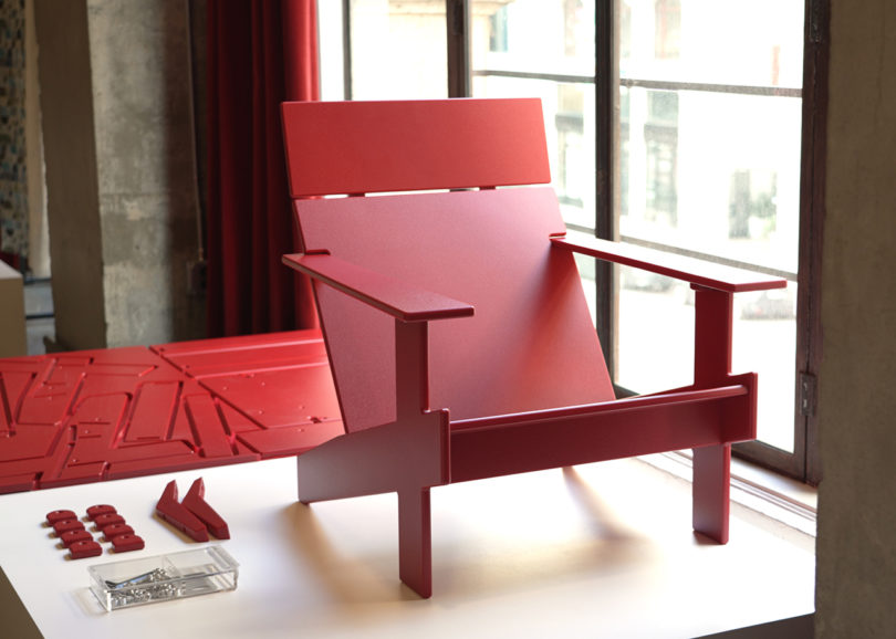 modern red adirondack style chair on display