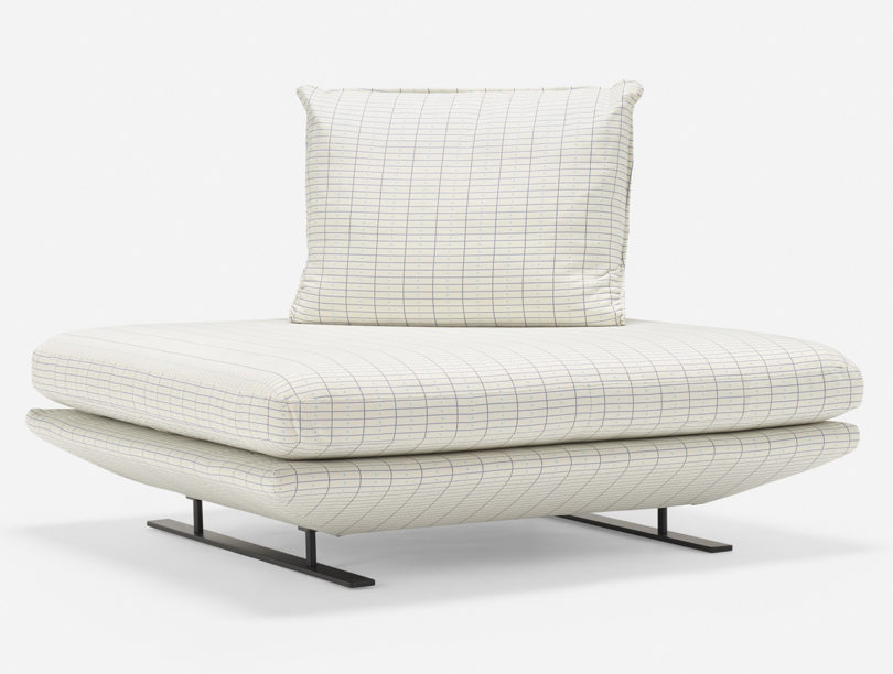 striped white section of sofa with pillow