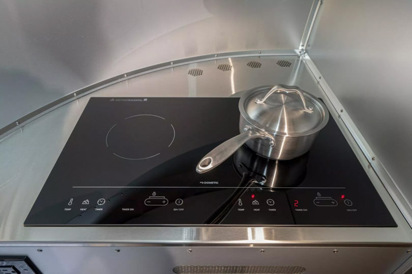 Induction stovetop with two cooktops and one pot.