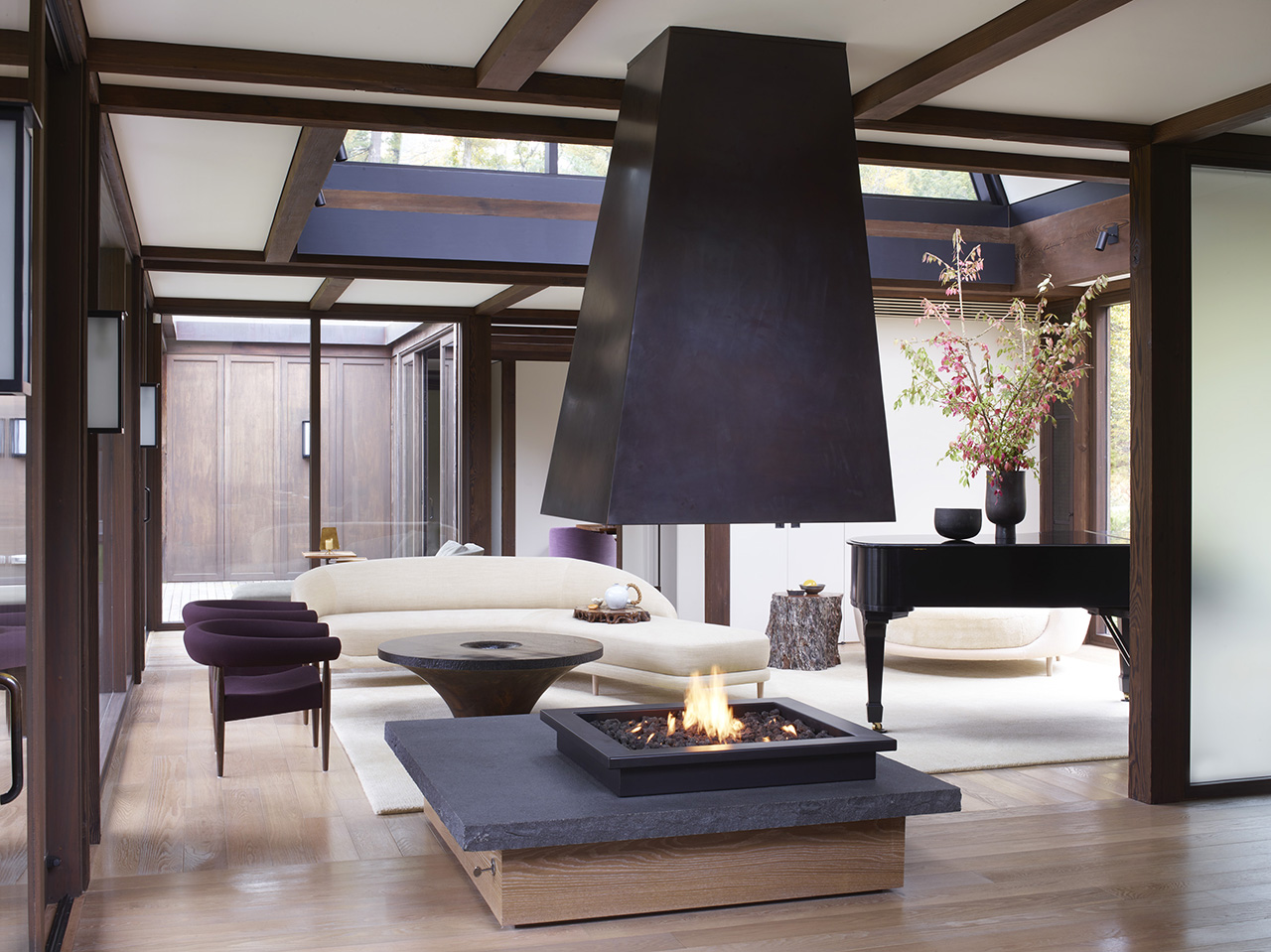 styled interior space with central fireplace
