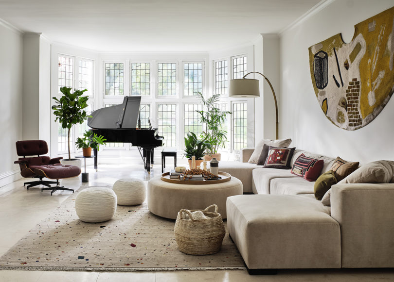 styled living space with baby grand piano