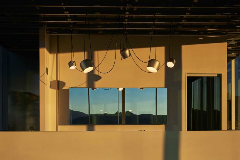 interior shot of modern space with black hanging light pendants