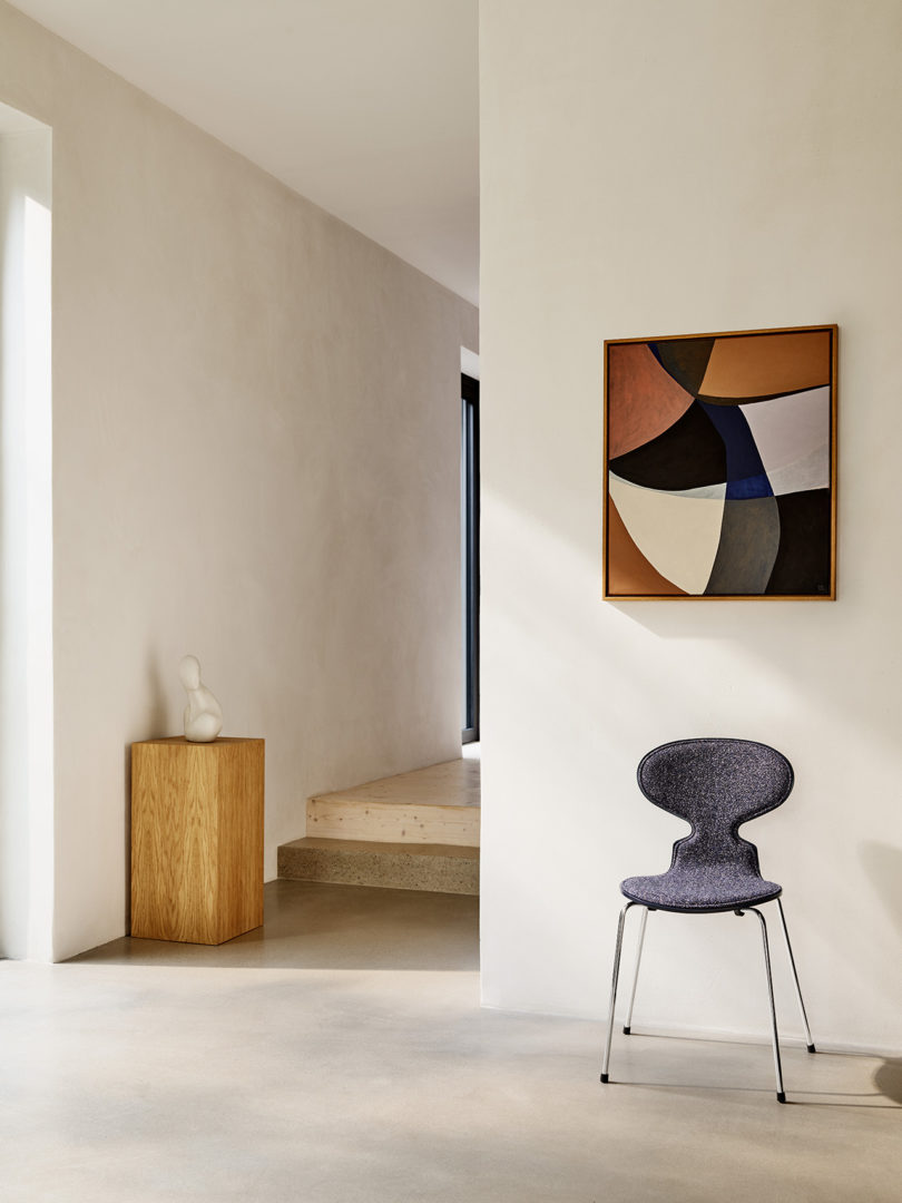 interior space with modern art, wood occasional table, and modern dining chair