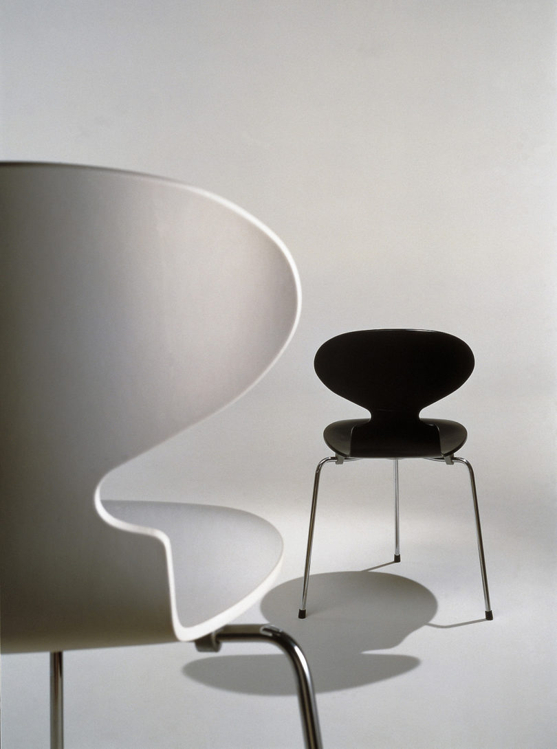 black and white archival images of two modern upholstered dining chairs