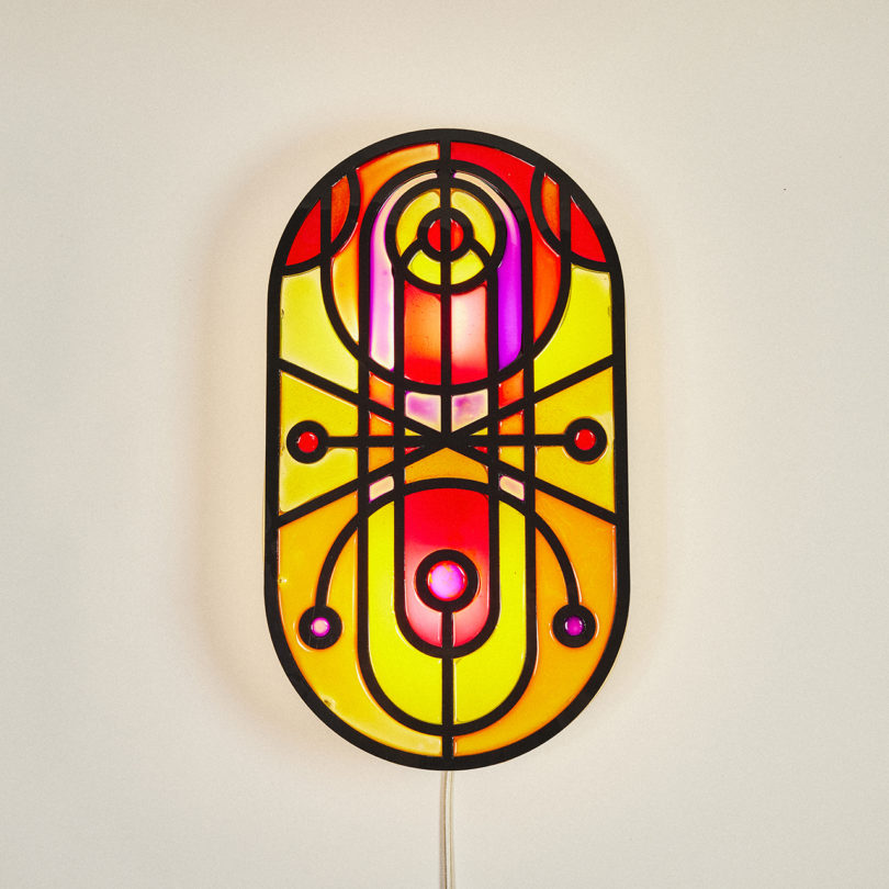red, pink, orange, and yellow wall lamp