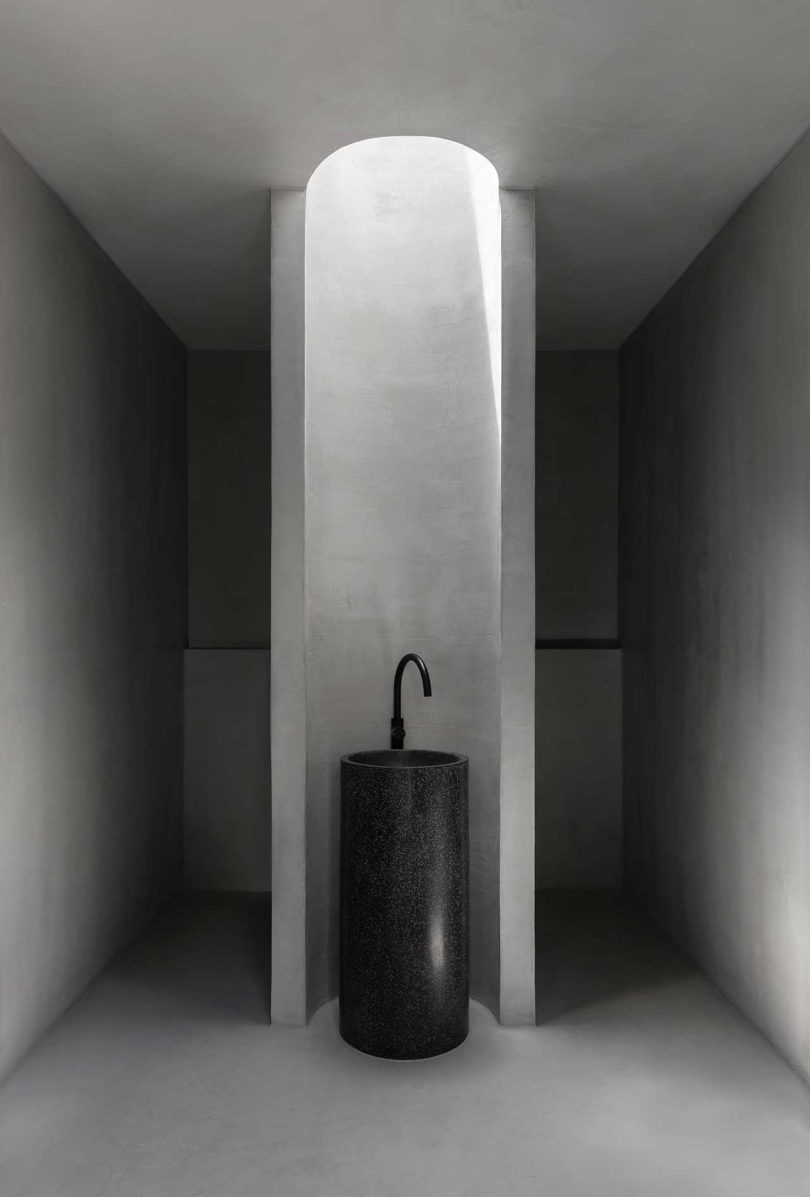 interior view of modern bathroom with sleek oval column sink