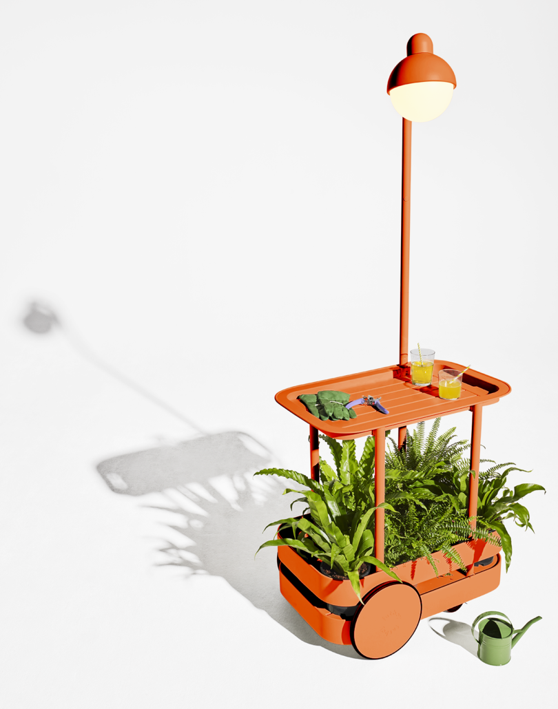 styled orange bar cart with light