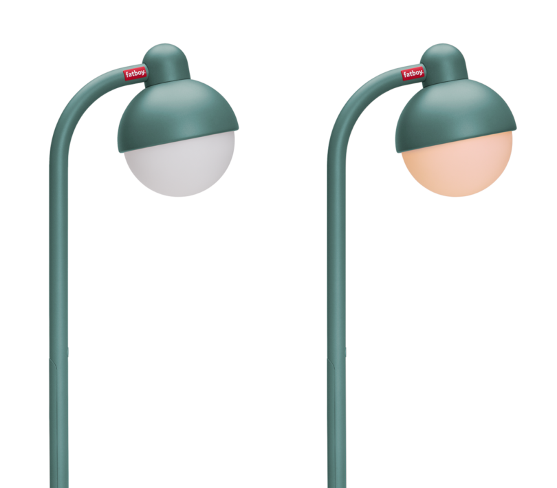 two teal lamps, on turned on the other turned off on a white background