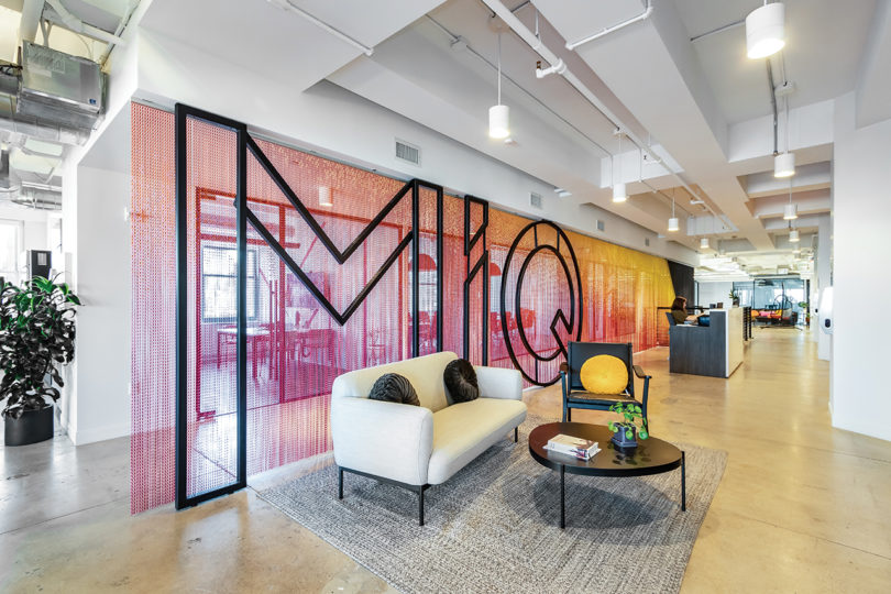 office installation of colorful chain links and the word MiQ in black