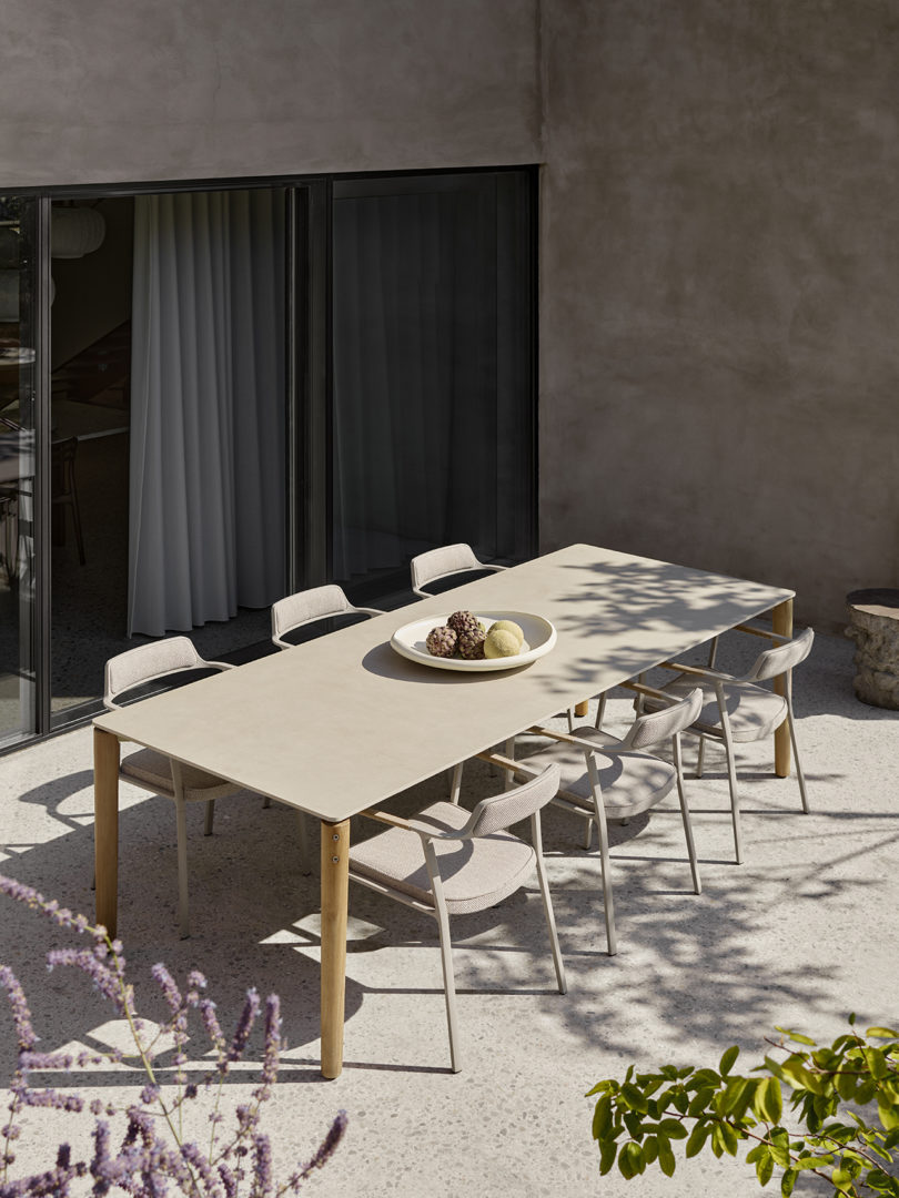 outdoor dining table and six armchairs styled