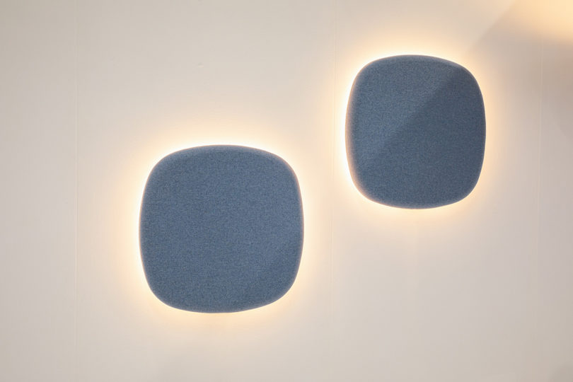 BuzziPebl Light decorative, acoustic wall sconce in blue.