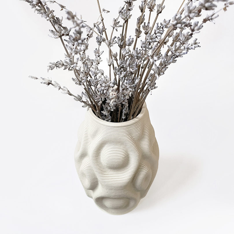 white 3D printed vase with lavender on a white background