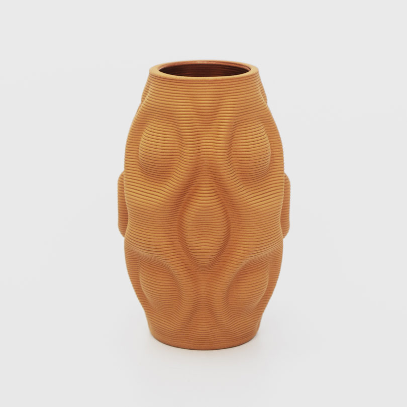 terracotta 3D printed vase a white background