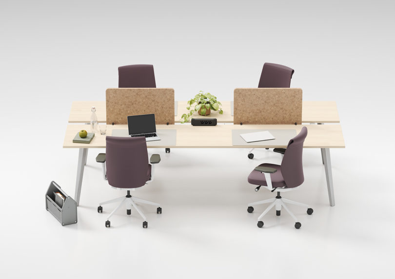 example of modular office furniture configuration on white background with four chairs, two on each side with a partition between each.