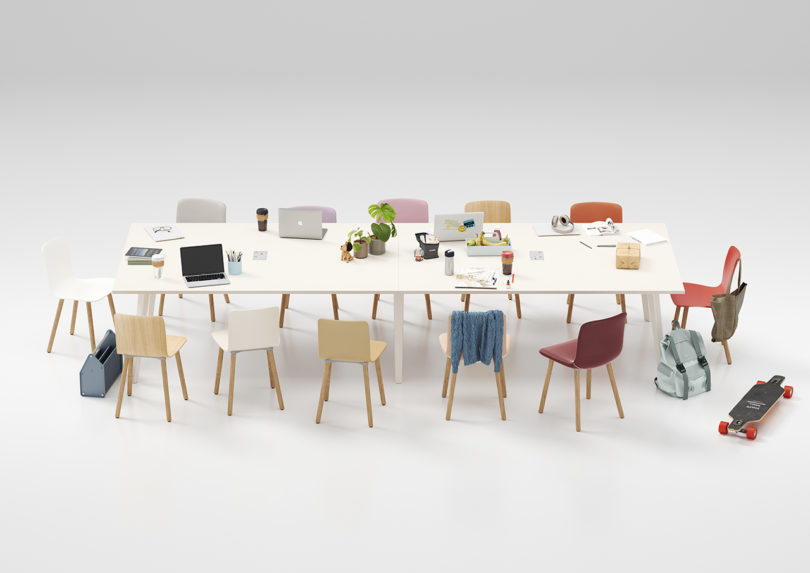 example of modular office furniture configuration on white background, long conference table with a multitude of different office chairs and a motorized skateboard in the bottom right hand corner.