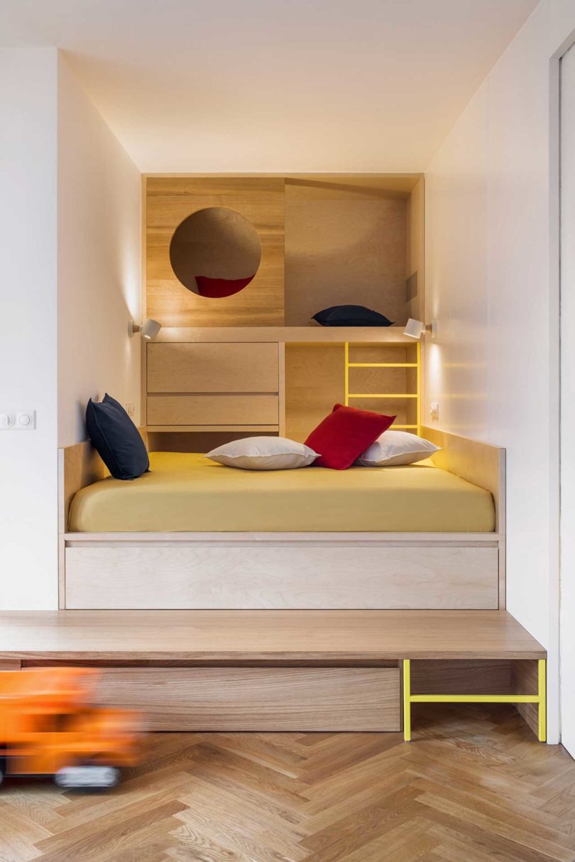 Built-in seating and bed nook with storage behind