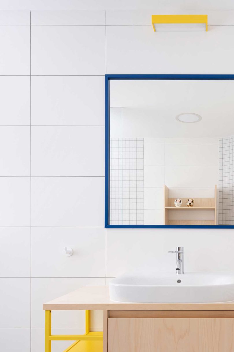 minimalist bathroom with yellow accents