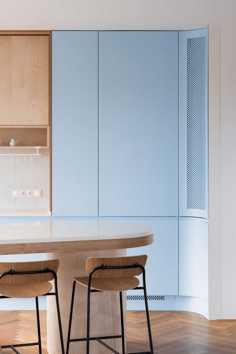closeup interior view of modern kitchen with blue cabinets