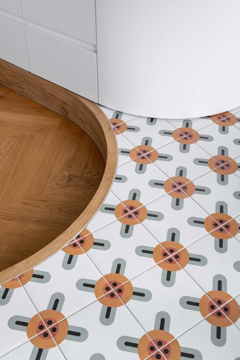closeup view of tiled floor next to wood floor