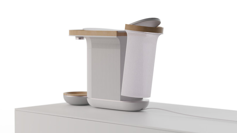 Woolly coffee machine render showing lids open for storage and water refilling.