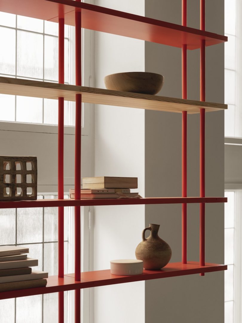 red modular shelving hung from ceiling
