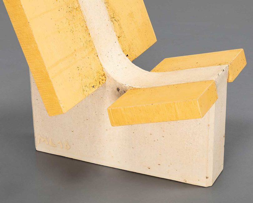 yellow concrete chair