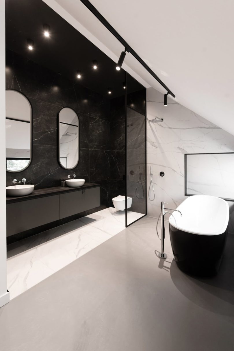 angled view of modern black and white bathroom