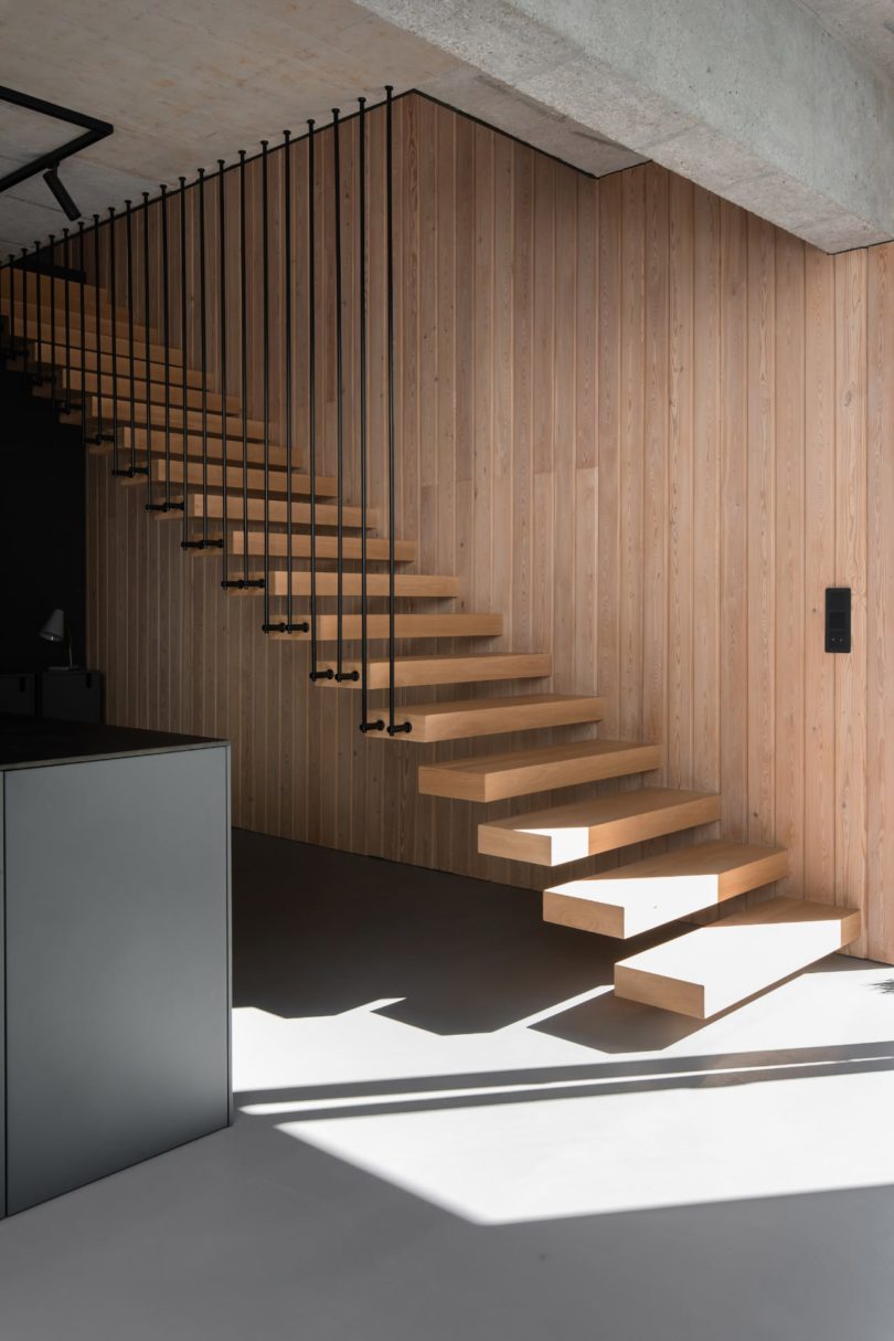 angled view of modern wood open staircase