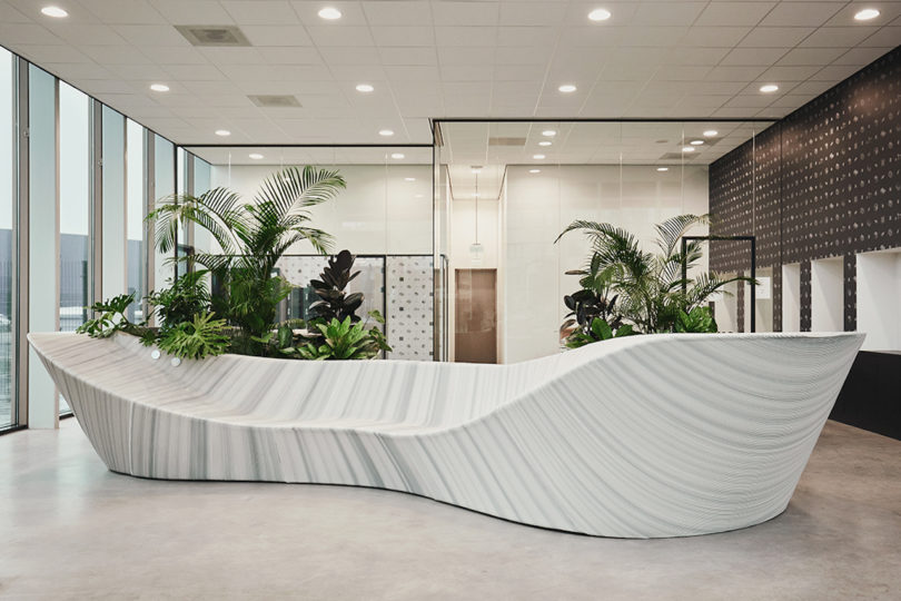 sculptural white and grey furniture in office lobby