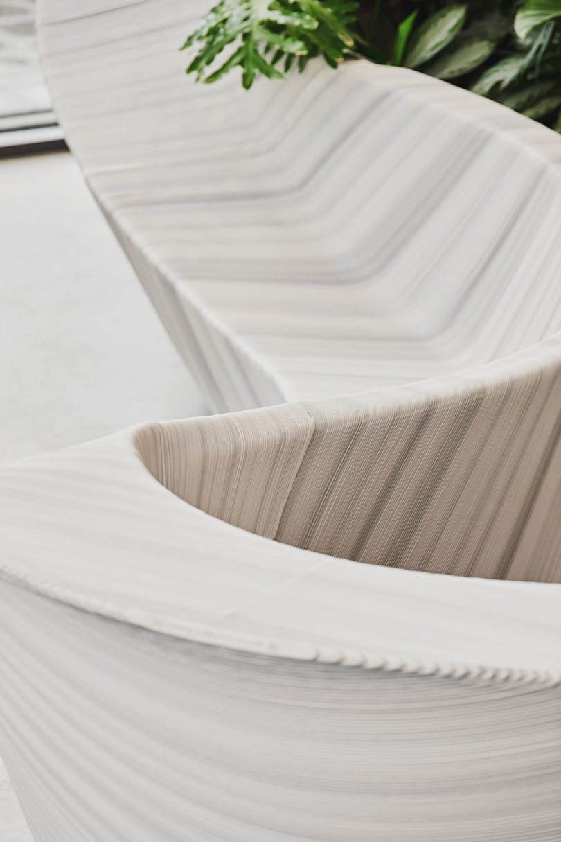 details of sculptural, white and grey furniture in office lobby