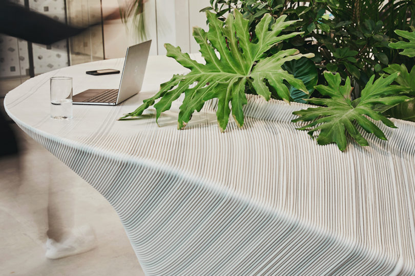details of sculptural, white and grey furniture in office lobby