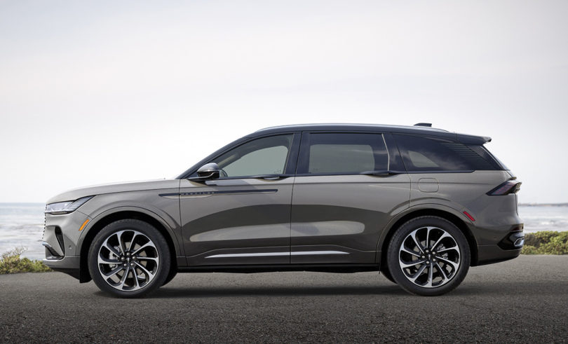 side of dark gray 2024 Lincoln Nautilus mid-size luxury SUV parked near coastline