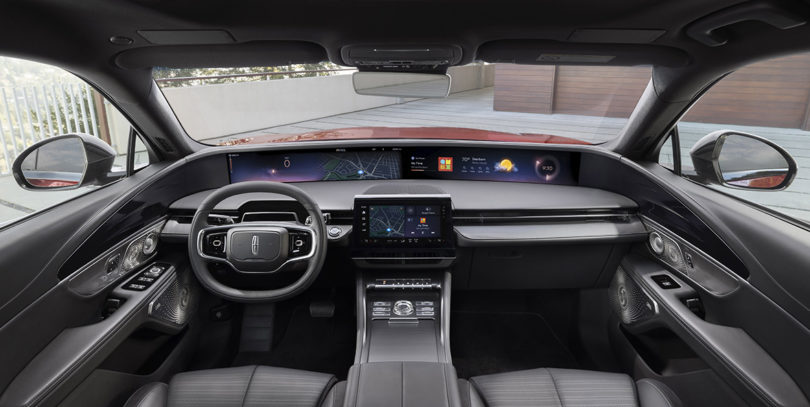 Wide angle shot of 2024 Lincoln Nautilus Reserve with Jet Appearance Package showing 48-inch horizontal display and 11-inch touchscreen control in center.