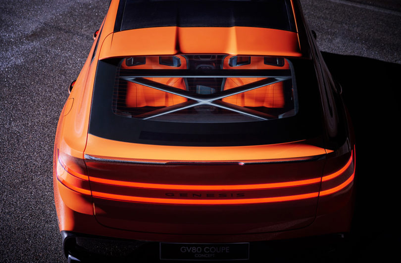 Red orange Genesis GV80 Coupe Concept shown from overhead into rear window.