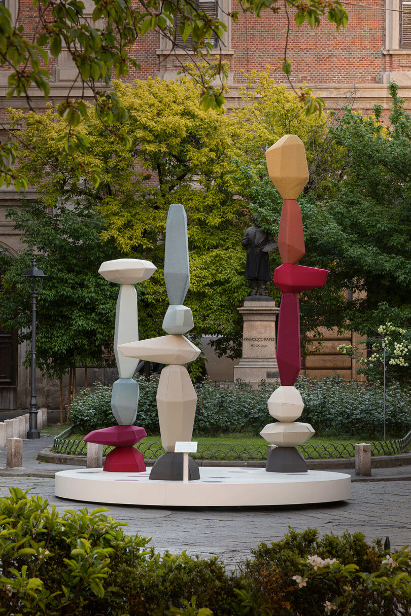 site specific installation with colorful towers of stacked objects