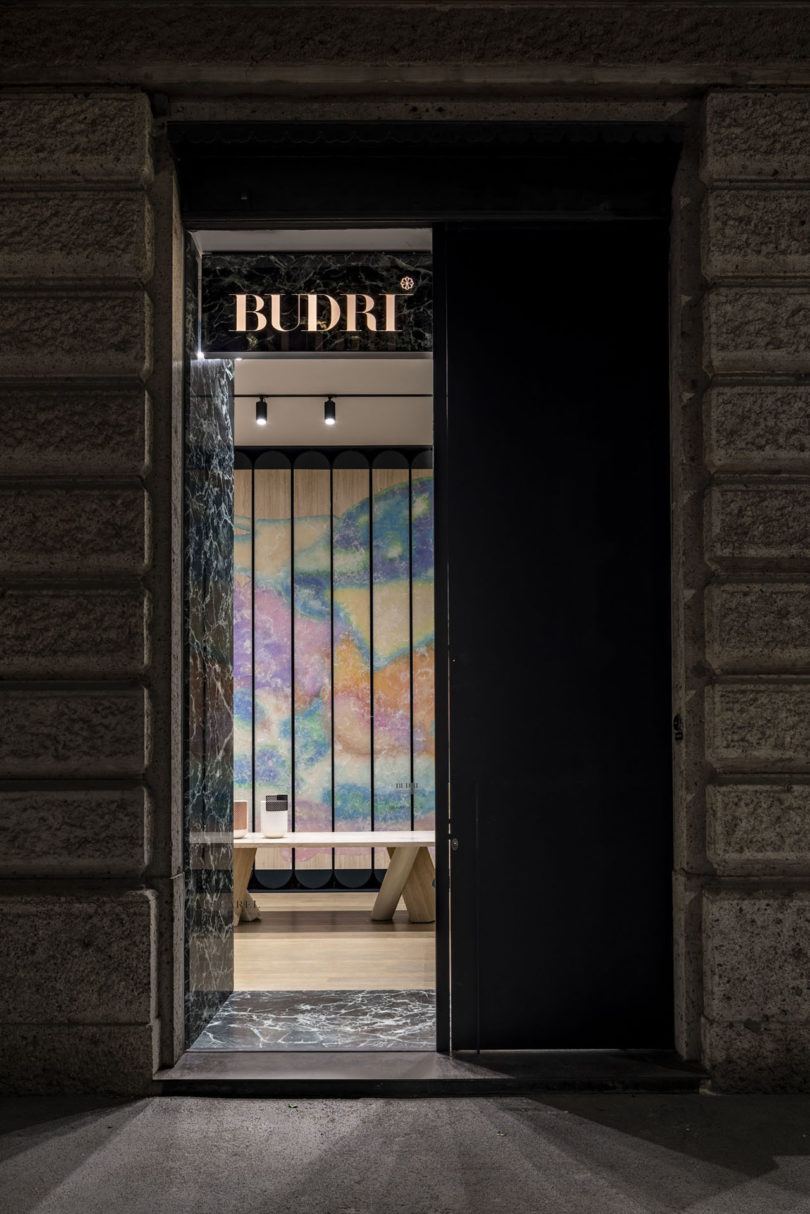 looking into the Budri showroom from outside at night