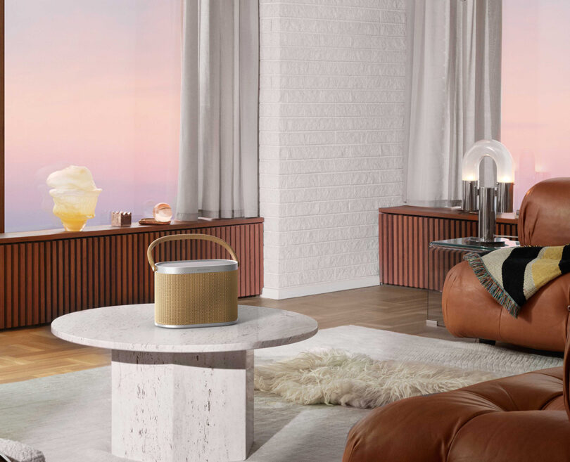 3D render of the A5 speaker in an imaginary modern living room with gradient light outside.