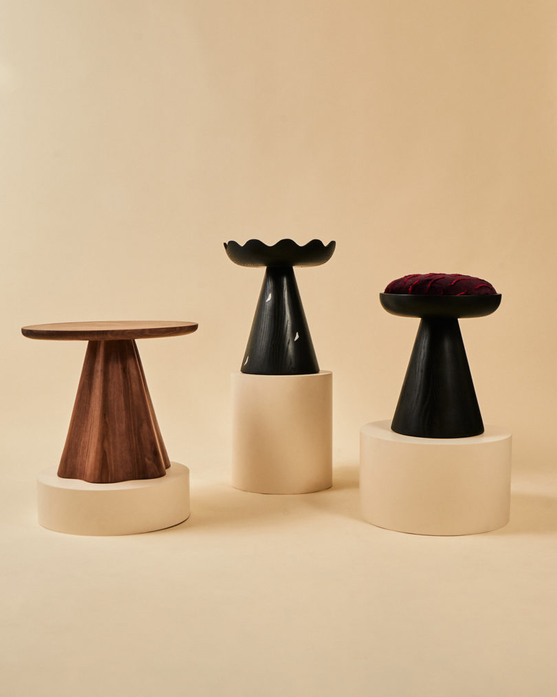 three occasional tables on plinths