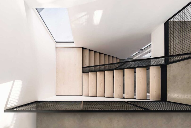 down view of modern wood and black staircase