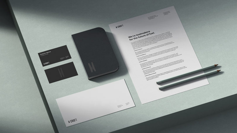 Croft stationery system showcasing holistic branding system – including bandmark, wordmark, CMF strategy, tone-of-voice, and packaging – set on light mint table.