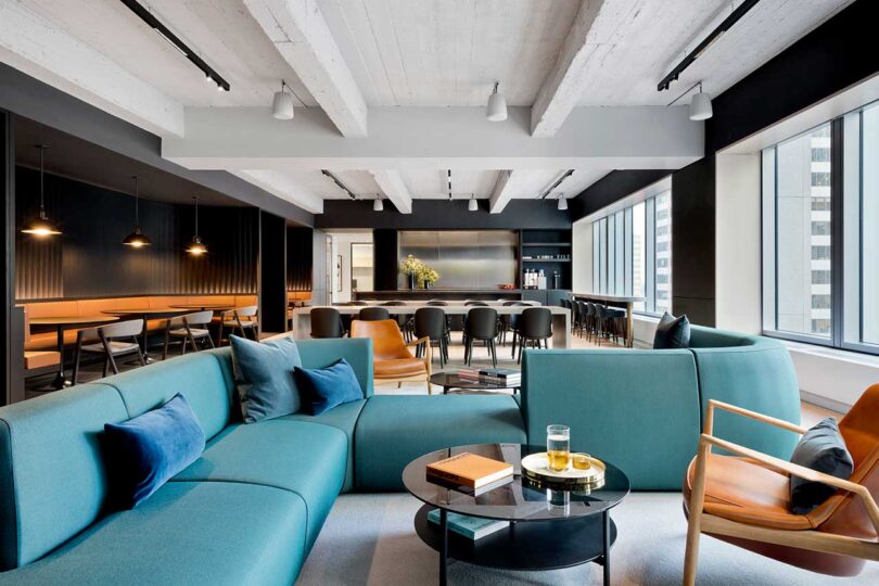 interior shot of modern club room with turquoise sofas