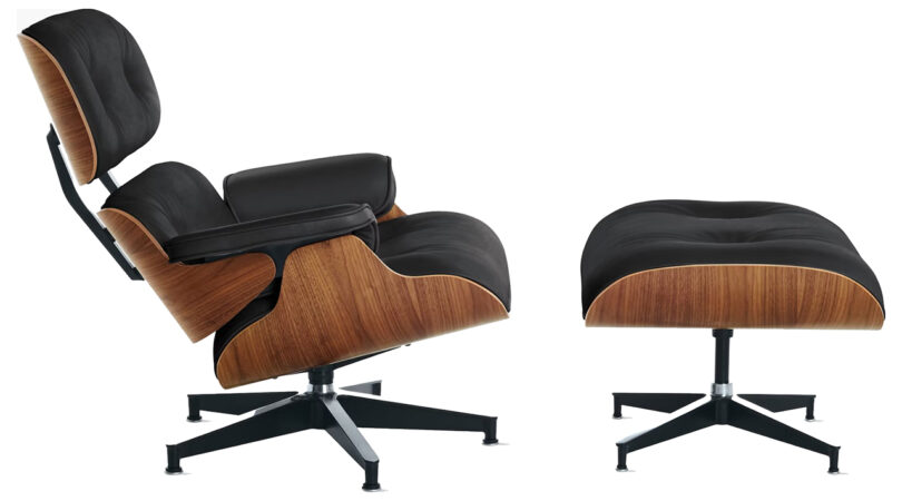 black Eames chair and ottoman on white background