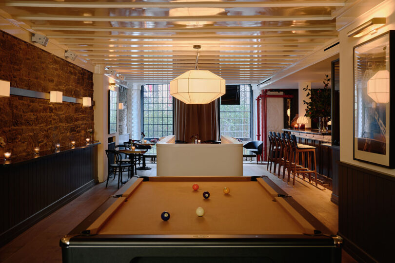 dark and classic bar space with pool table